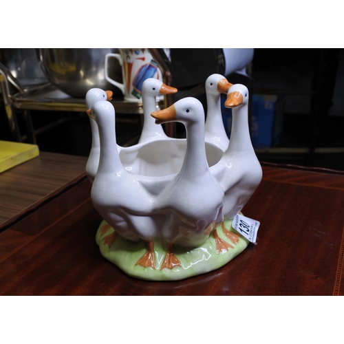 130 - A ceramic planter with in the shape of six ducks.