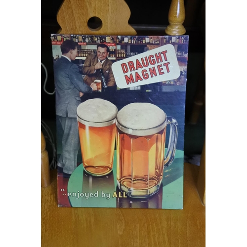 140 - An advertising card bar display, reading 'Draught Magnet... enjoyed by all'.