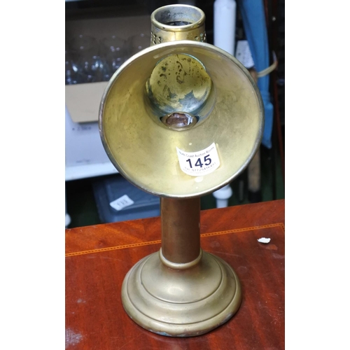 145 - A vintage brass spotlight candle holder.