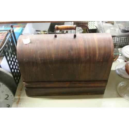 155 - A wood cased table top Singer sewing machine.