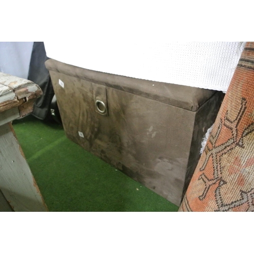 169 - A brown ottoman.