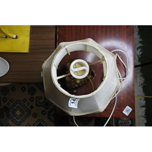 143 - A Dimple's whisky bottle which has been covered in shells and converted into a table lamp.