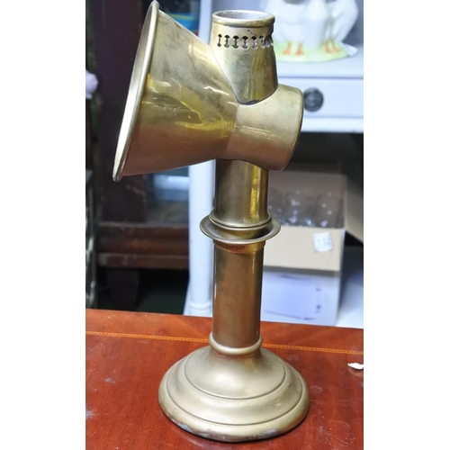 145 - A vintage brass spotlight candle holder.