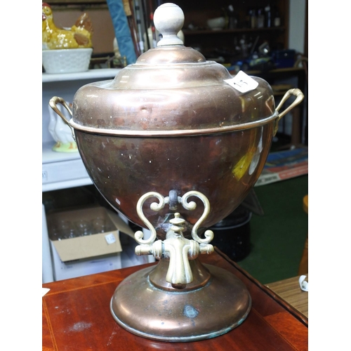146 - An antique / vintage copper and brass samovar / drinks dispenser.