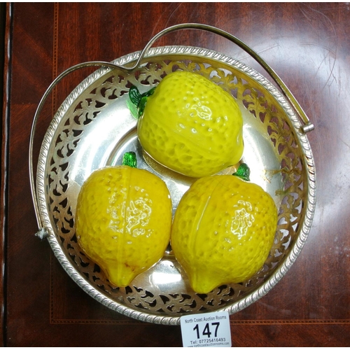 147 - Three vintage glass lemons on a silver plated tray.