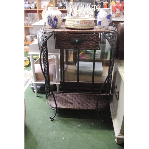 151 - A metal and wicker console / hall table.