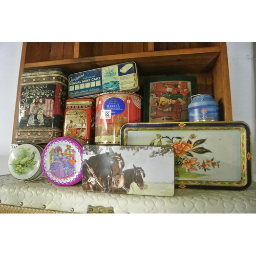 165 - An assortment of retro advertising tins.