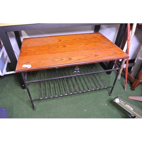 201 - A heavy duty wrought iron framed coffee table with wood top.
