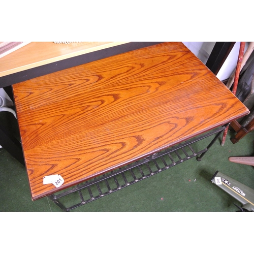 201 - A heavy duty wrought iron framed coffee table with wood top.