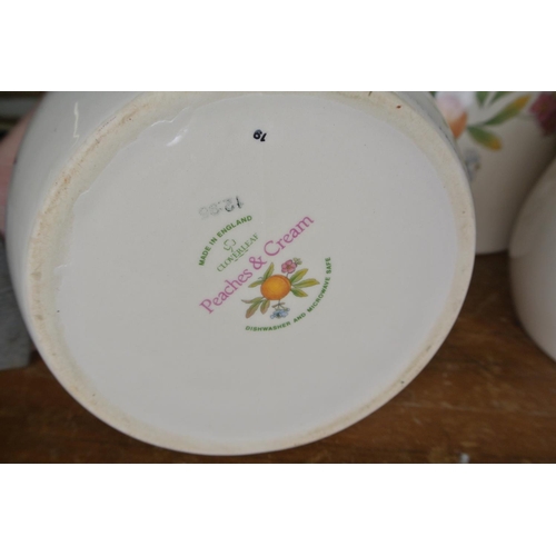 245 - A Cloverleaf 'Peaches and Cream', ceramic beard bin, tea jar, and sugar jar.