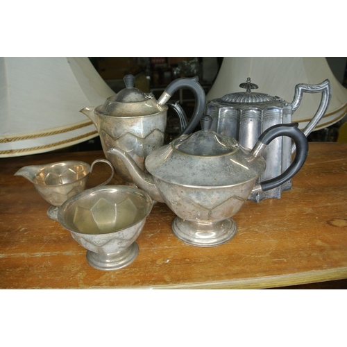 250 - An assortment of silver plate items to include two teapots, a coffee pot, sugar bowl and milk jug.