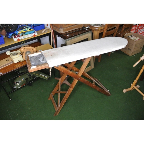 254 - A vintage ironing board.