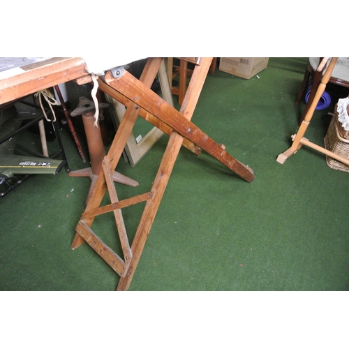 254 - A vintage ironing board.