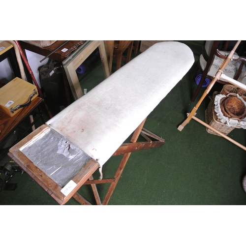 254 - A vintage ironing board.