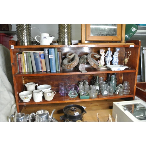 283 - A wooden book shelf.