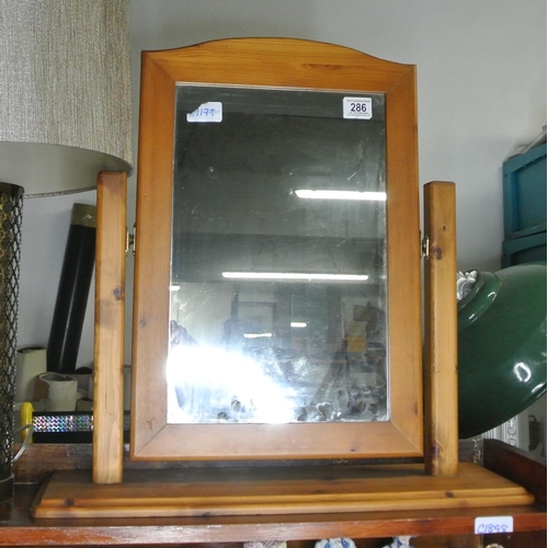 286 - A pine framed dressing table / bathroom mirror.