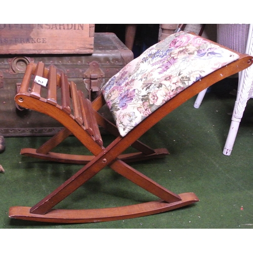 288 - A rocking foot stool with decorative upholstery.