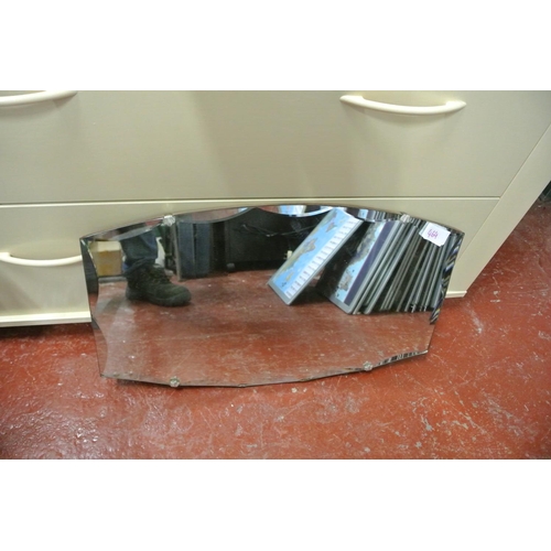464 - A bevelled glass frameless mirror.