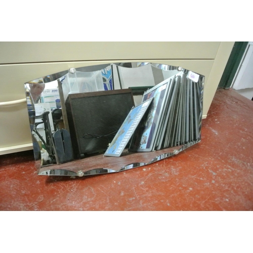 464 - A bevelled glass frameless mirror.