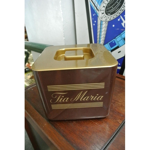 488 - A Tia Maria ice bucket along with a Vacuvin wine cooler.