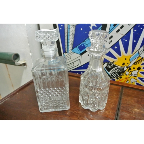 491 - Two cut glass decanters.
