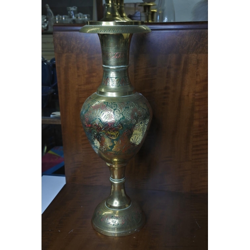 109 - A large Indian brass vase with coloured detailing.