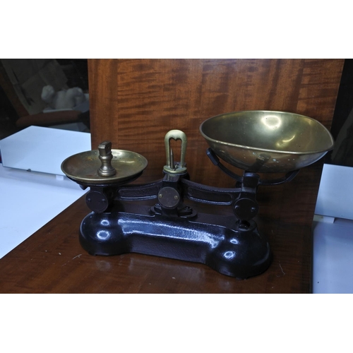 134 - A set of old scales with trays and weight.