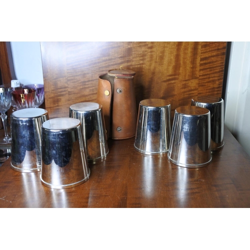 180 - A set of silver plated Whiskey tumblers in leather case.