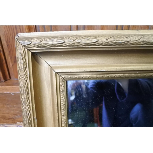 214 - A decorative gilt framed wall mirror.