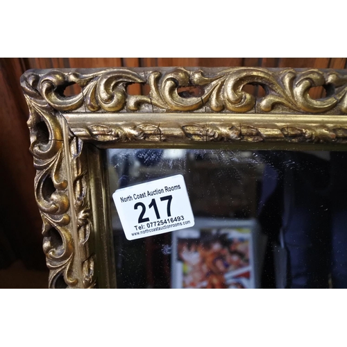 217 - A gilt framed wall mirror.