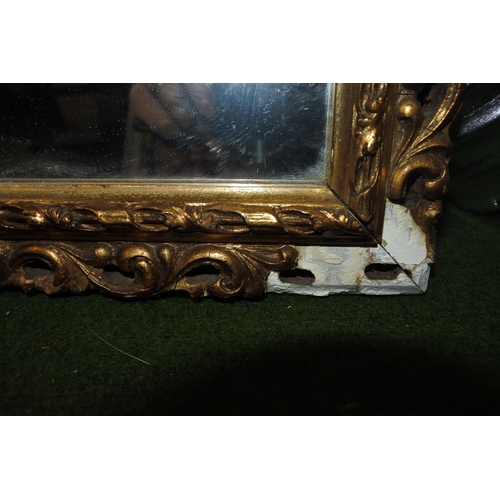 217 - A gilt framed wall mirror.