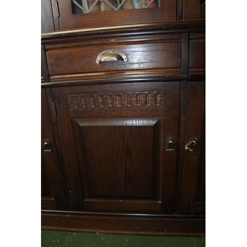 219 - A display cabinet, ideal for upcycling, with lead glass doors and carved detail.