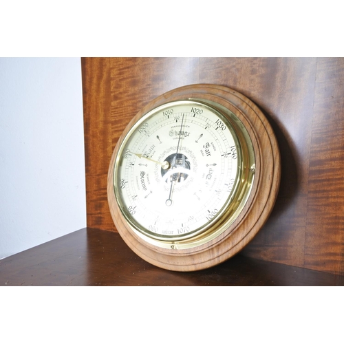 65 - A circular barometer.