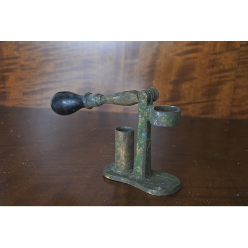 67 - An antique shotgun cartridge reloading tool.