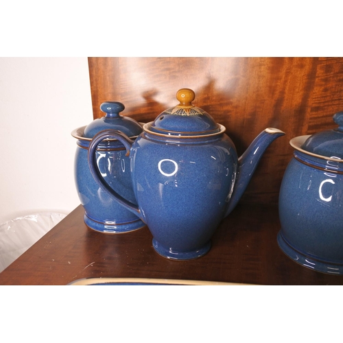 71 - A Denby coffee pot, two lidded storage jars and a casserole dish