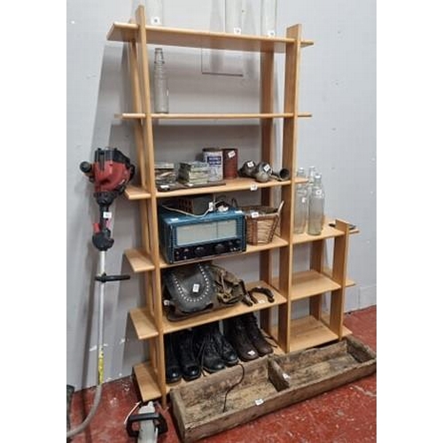 63 - A large wooden shelving unit.