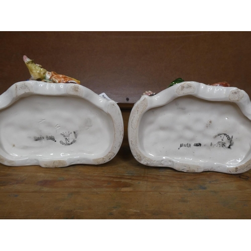 156 - 2 vintage Capodimonte 'Tramps on benches'.