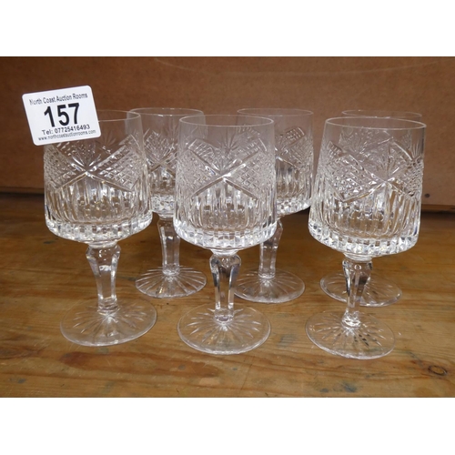157 - A set of six crystal wine glasses (one a/f)