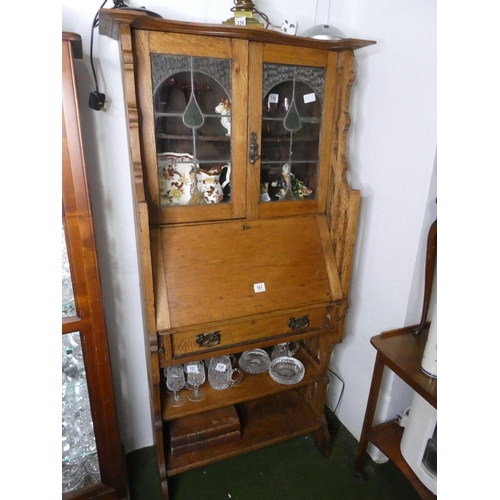 161 - An antique/Art Nouveau oak bookcase bureau, with leaded glass doors.