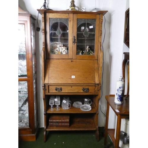 161 - An antique/Art Nouveau oak bookcase bureau, with leaded glass doors.