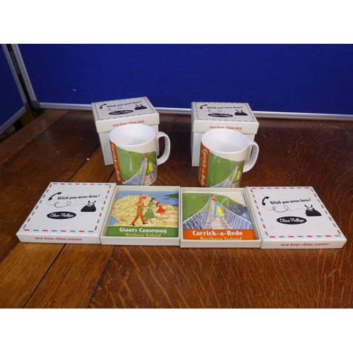 107 - A collection of 4 boxed Clare Phillips pieces, to include 2 mugs & 2 coasters.