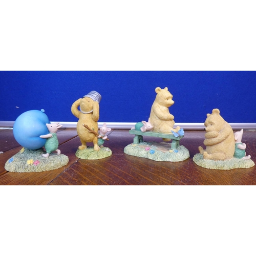 110 - A collection of 4 Border Fine Arts Classic Pooh/ Winnie The Pooh figures.