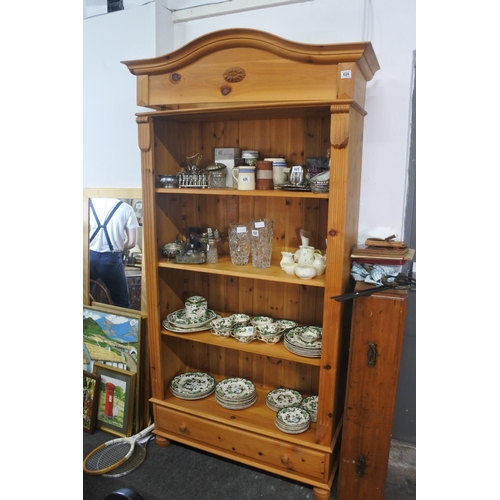 624 - A large pine bookcase with drawers to base.