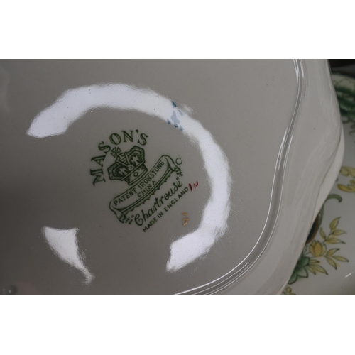 633 - A collection Masons Ironstone Green 'Chartreuse' to include ginger jar, platter & more.