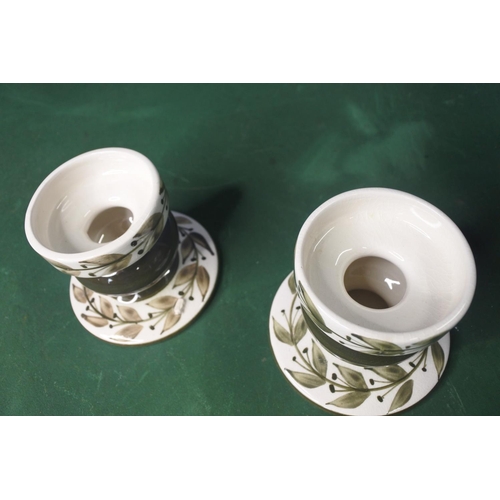 642 - A pair of Jersey Pottery candlesticks.