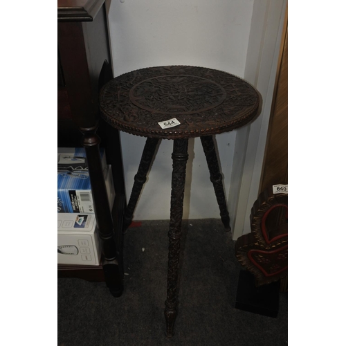 644 - A stunning antique highly carved table on tripod base.