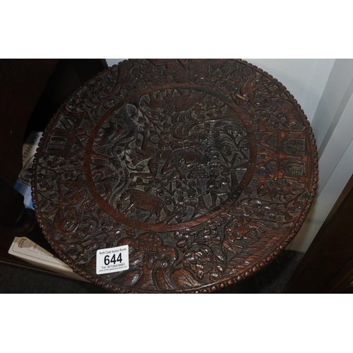 644 - A stunning antique highly carved table on tripod base.