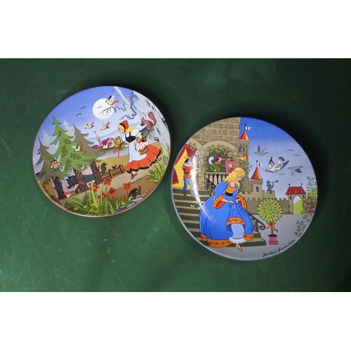 652 - A pair of Poole Pottery plates, 'Cinderella' & 'Little Red Riding Hood'.