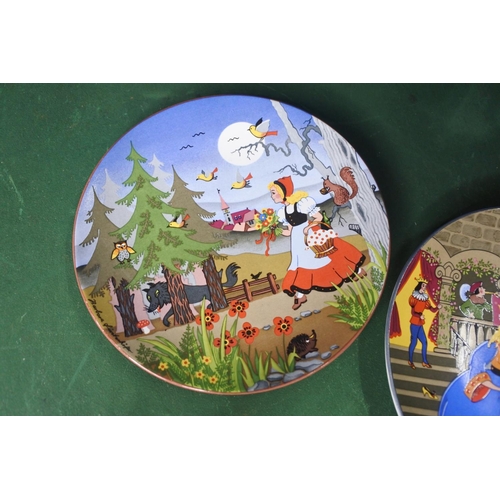 652 - A pair of Poole Pottery plates, 'Cinderella' & 'Little Red Riding Hood'.