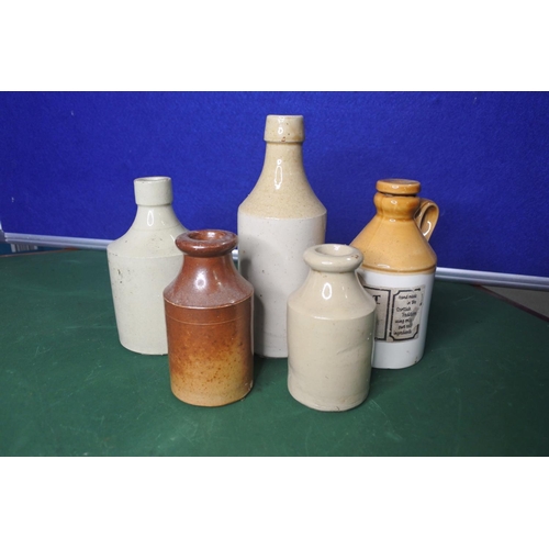 656 - An assortment of various stoneware bottles.